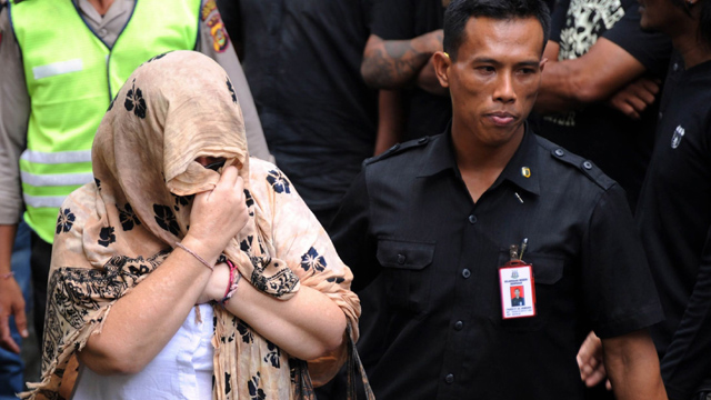 Lindsay Sandiford escorted by police after trial for smuggling cocaine into Bali