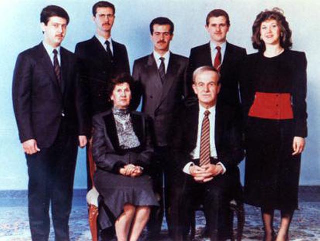 The al-Assad family in 1994 before Basel's death.  The Assad family. Hafez al-Assad and his wife, Mrs Anisa Makhlouf. On the back row, from left to right: Maher, Bashar, Basil, Majid, and Bushra al-Assad.
