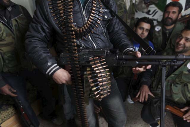 Free Syrian Army members (rebel group) at their base on/Getty Images