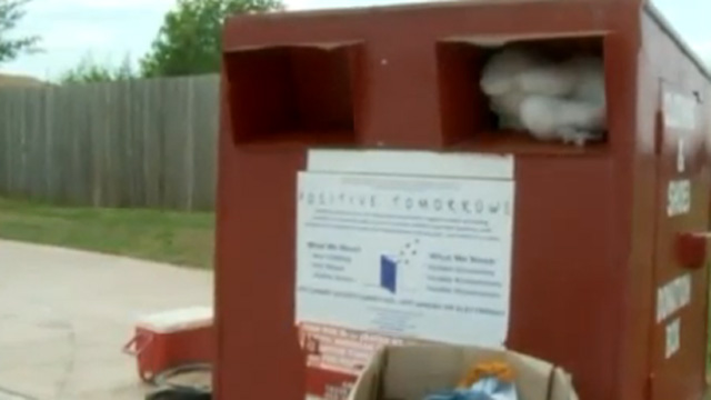 Woman Gets Stuck in Donation Box