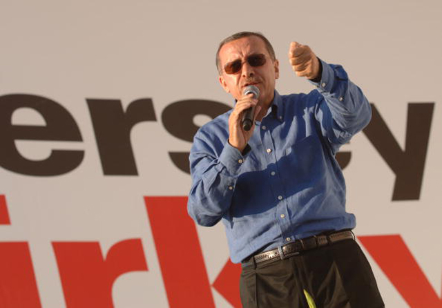 Turkish Prime Minister Tayyip Erdogan gestures to his supporters during a rally of his ruling AK Party (Getty Images)