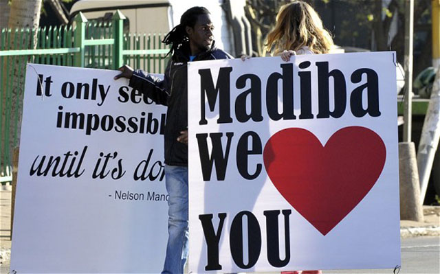 Supporters concentrate out of the hospital where Nelson Mandela remains in critical condition (Getty Images)