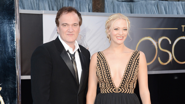 Director Quentin Tarantino and writer Lianne Spiderbaby arrive at the 2013 Oscars (Getty Images)