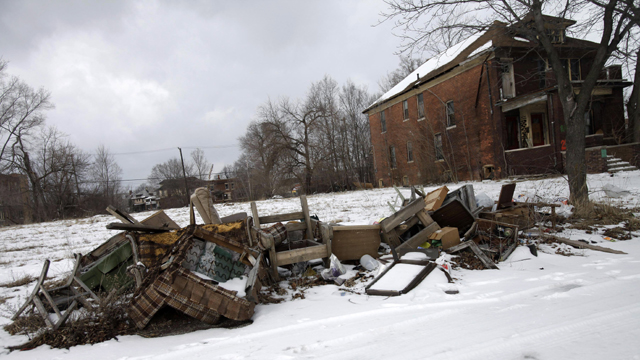 Trash is seen lying alongside a street in Detroit  (Getty Images)