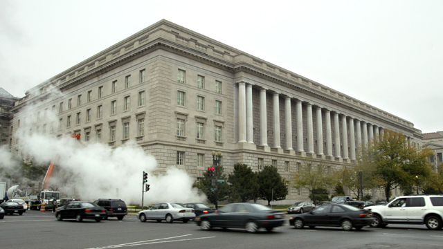 Steam rises from a grate outside the Internal Revenue Service headquarters building (Getty Images)