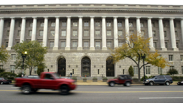 Cars drive past the Internal Revenue Service headquarters building (Getty Images)