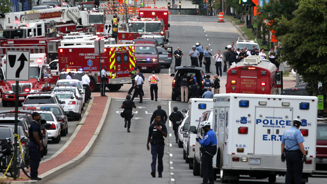 Emergency vehicles and law enforcement personnel respond to a shooting at an entrance to the Washington Navy Yard this morning.  (Getty)