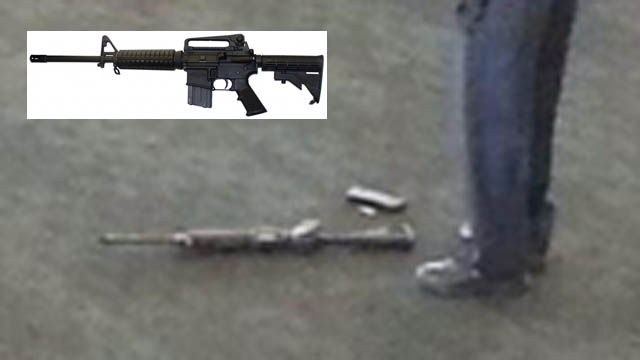 The possible weapon used in today's LAX shooting spree lies on the ground near the foot of an investigator. Reports suggest it was an AR-15 rifle. INSET: An AR-15. 