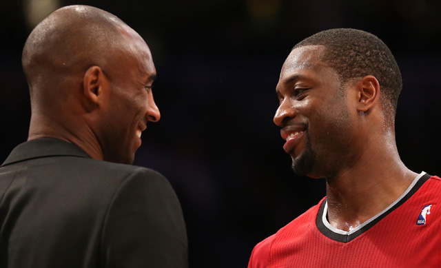 Dwyane Wade talks with Kobe Bryant after the game at Staples Center on December 25, 2013. Wade reportedly visited his baby son while in town for the game. (Getty)