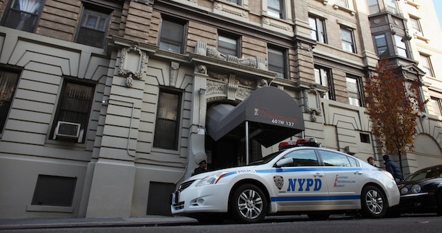 Police wait outside the NYC apartment Pimentel shred with his mother. From November, 2011. (Getty)