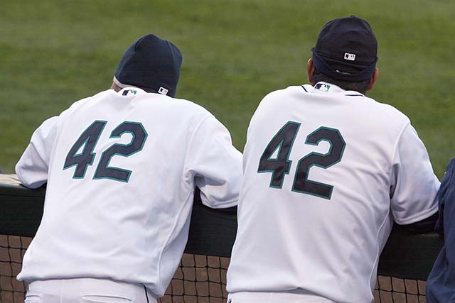 Two Seattle Mariners players wearing No. 42 before a game against the Los Angeles Angels in 2009. (Getty)