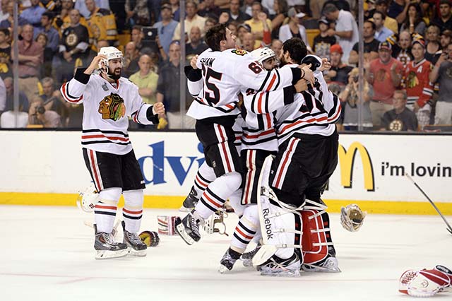 The Chicago Blackhawks celebrate after beating the Boston Bruins last year to win the Stanley Cup. (Getty)