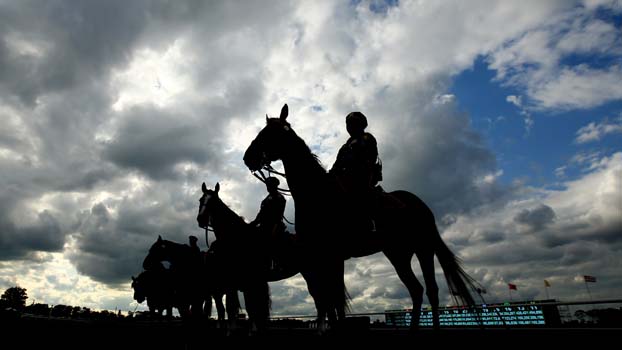 Authorities stand at attention before the 145th running of the Belmont Stakes. (Getty)