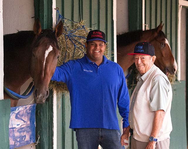 Owner Ron Sanchez (left) and trainer Manny Azpurua (right) get Social Inclusion ready for The Preakness 2014.