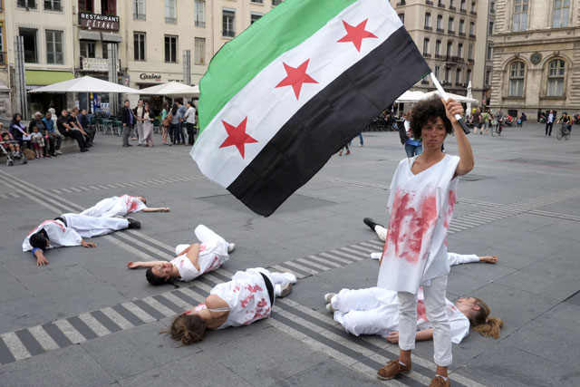 Protesters in France hold a demonstration to condemn the war in Syria. (Getty)