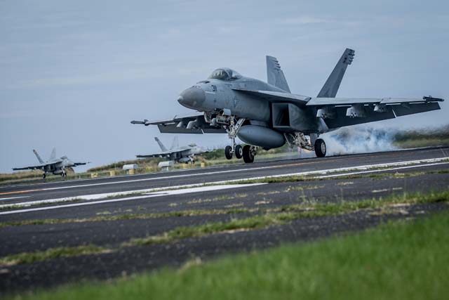 U.S. Navy Conduct Field Carrier Landing Practice In Iwo Jima
