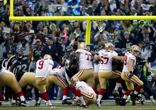 Seahawks 49ers NFC Championship Game Russell Wilson Colin Kaepernick The 12th Man.