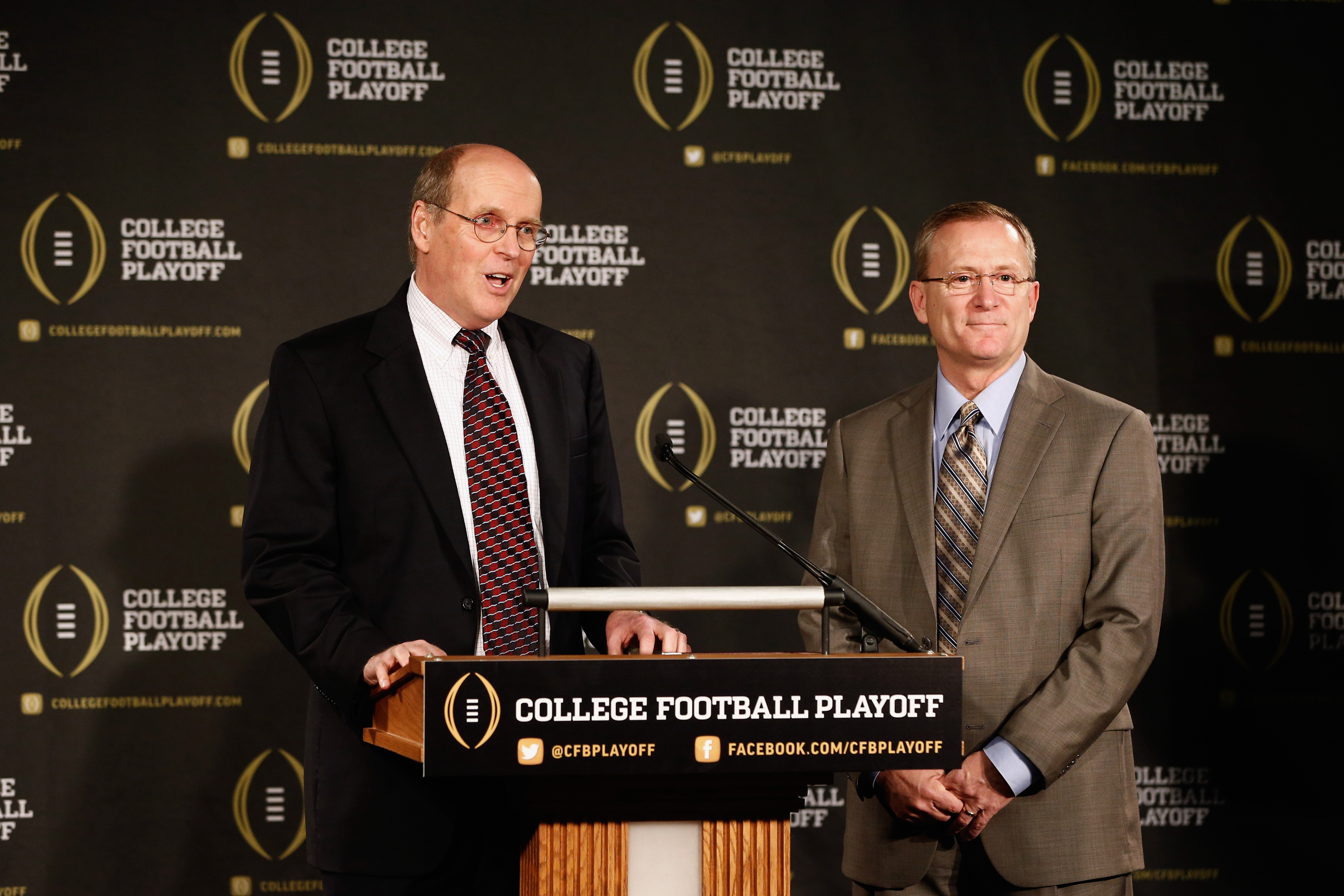 From left: Bill Hancock, executive director of the College Football Playoff, introduces Jeff Long as the chairman of the selection committee. Long will serve as the chairman of the 13 member committee that will select four teams to compete in the first playoff at the end of the 2014 season.  (Getty)