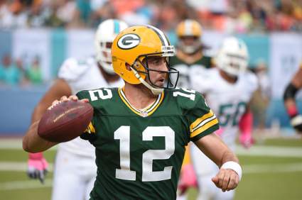 WATCH: Aaron Rodgers Injured & Carted Off After TD Pass