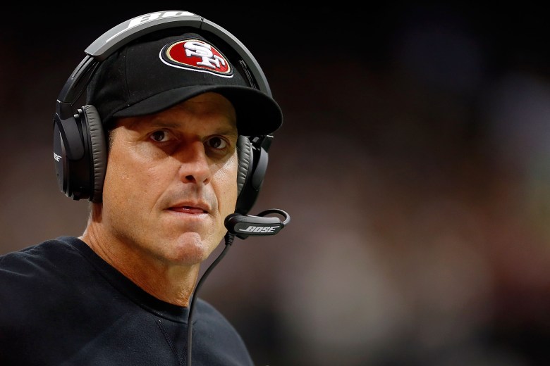 Is Jim Harbaugh headed to Michigan? The 49ers coach has been offered a 6-year deal for the Wolverines' vacant job. (Getty)