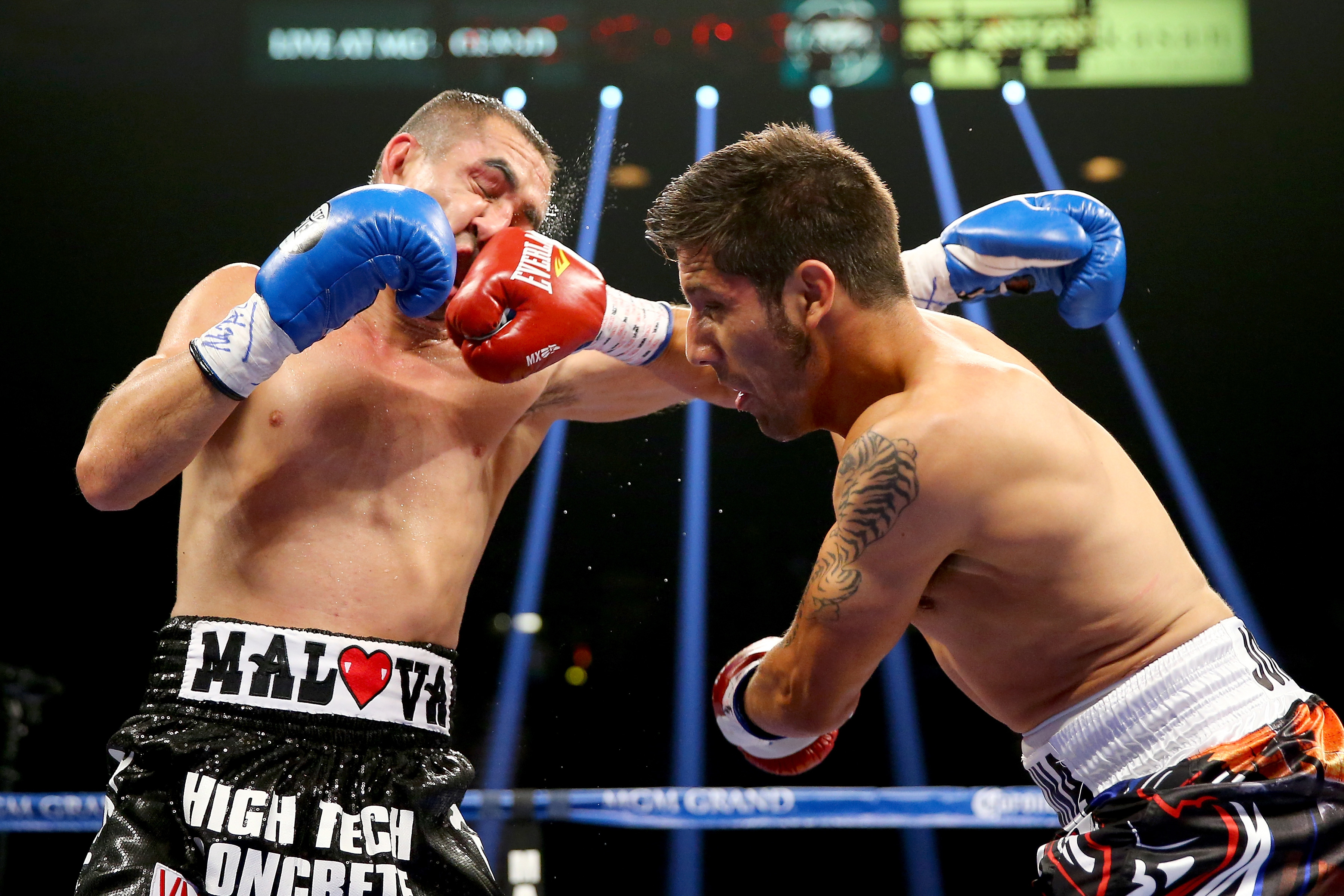 (R-L) John Molina Jr. connects with a right to the face of Humberto Soto. (Getty) 