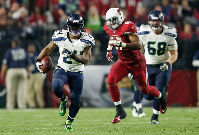 Seattle's Marshawn Lynch tied for the NFL lead with 13 rushing touchdowns. (Getty)