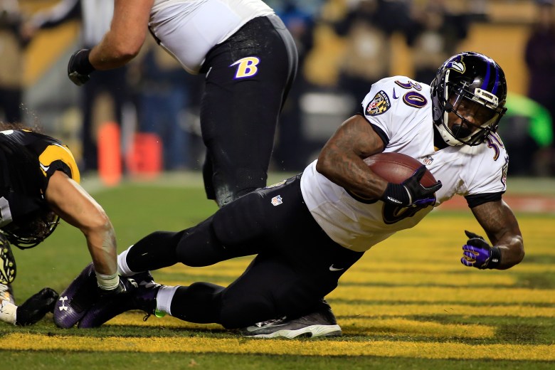 Bernard Pierce and the Ravens bullied the Steelers last week to set up Saturday's showdown with the Patriots. (Getty)