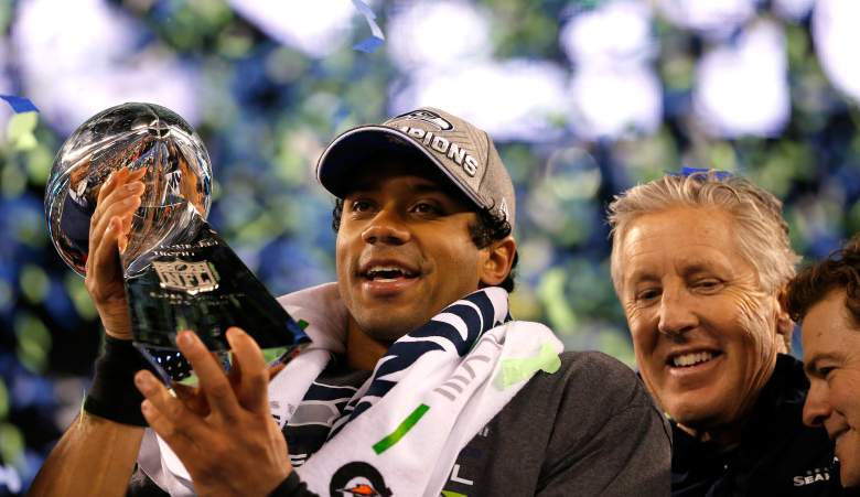 Russell Wilson holds up the Lombardi Trophy after winning last year's Super Bowl. (Getty)