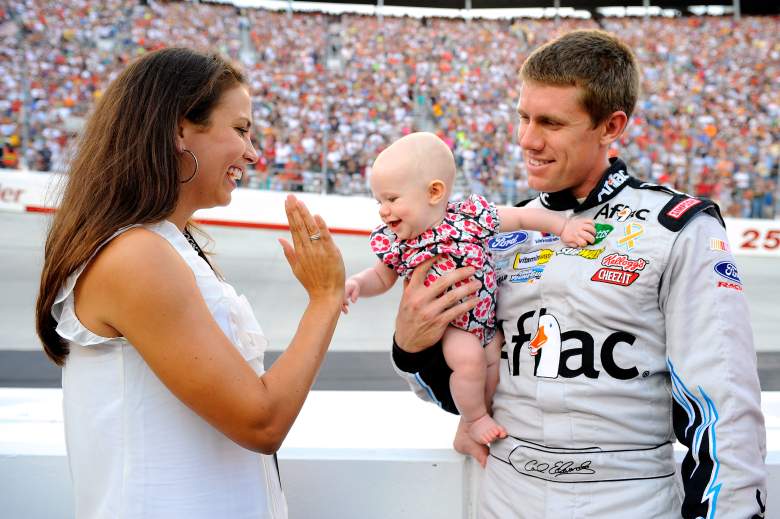 Edwards and his wife Kate with their daughter Anna at the start of an August 2010 Sprint Cup race. (Getty)