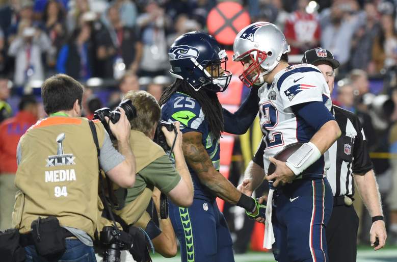 Seahawks cornerback Richard Sherman and Patriots quarterback Tom Brady shake hands after Super Bowl 49. (Getty)