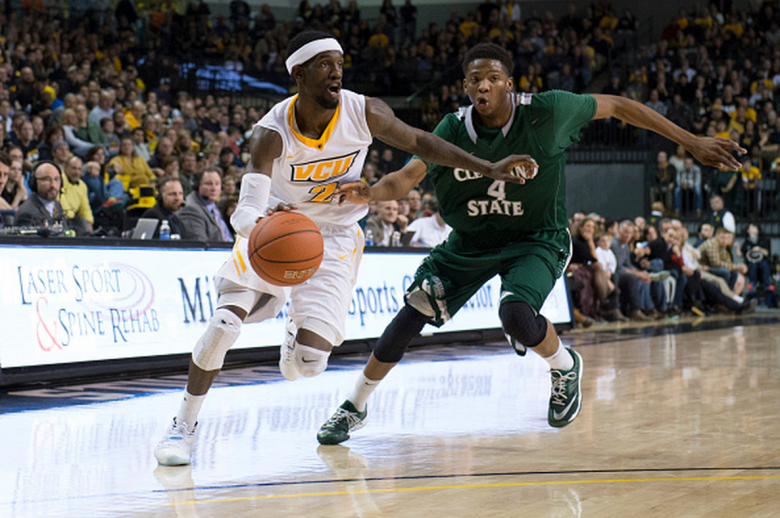 Briante Weber of the Virginia Commonwealth Rams drives to the basket as Kenny Carpenter of the Cleveland State Vikings defends  during the second half at the Siegel Center on December 29, 2014 in Richmond,  Virginia. (Getty)