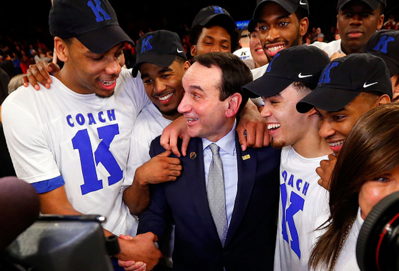 Head coach Mike Krzyzewski of the Duke Blue Devils celebrates with his players after defeating the St. John's Red Storm earning his 1,000th career victory on January 25 2015 at Madison Square Garden in New York City. Duke defeated St John's 77-68. (Getty)