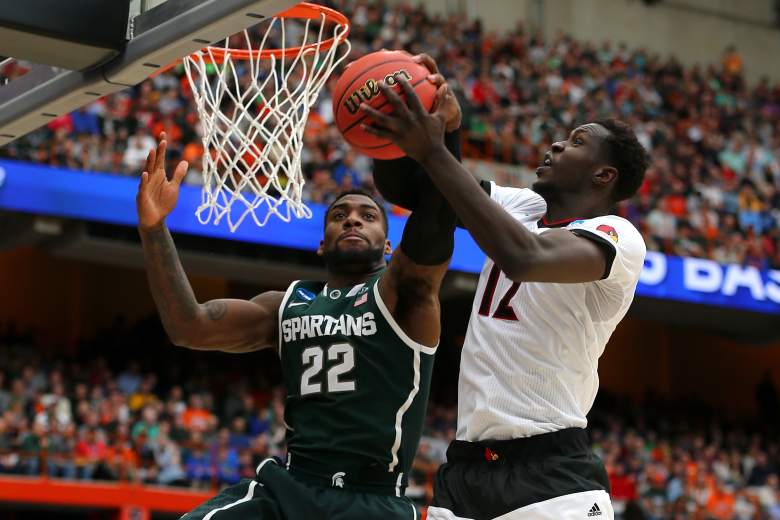 Branden Dawson of Michigan State  blocks the shot of Louisville's Mangok Mathiang Sunday. (Getty)