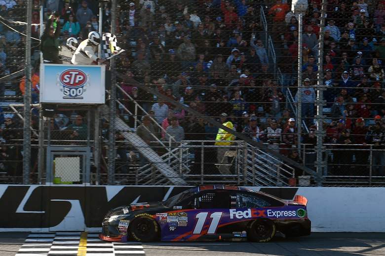 Denny Hamlin takes the checkered flag in Sunday's STP 500 at Martinsville Speedway in Virginia. (Getty)