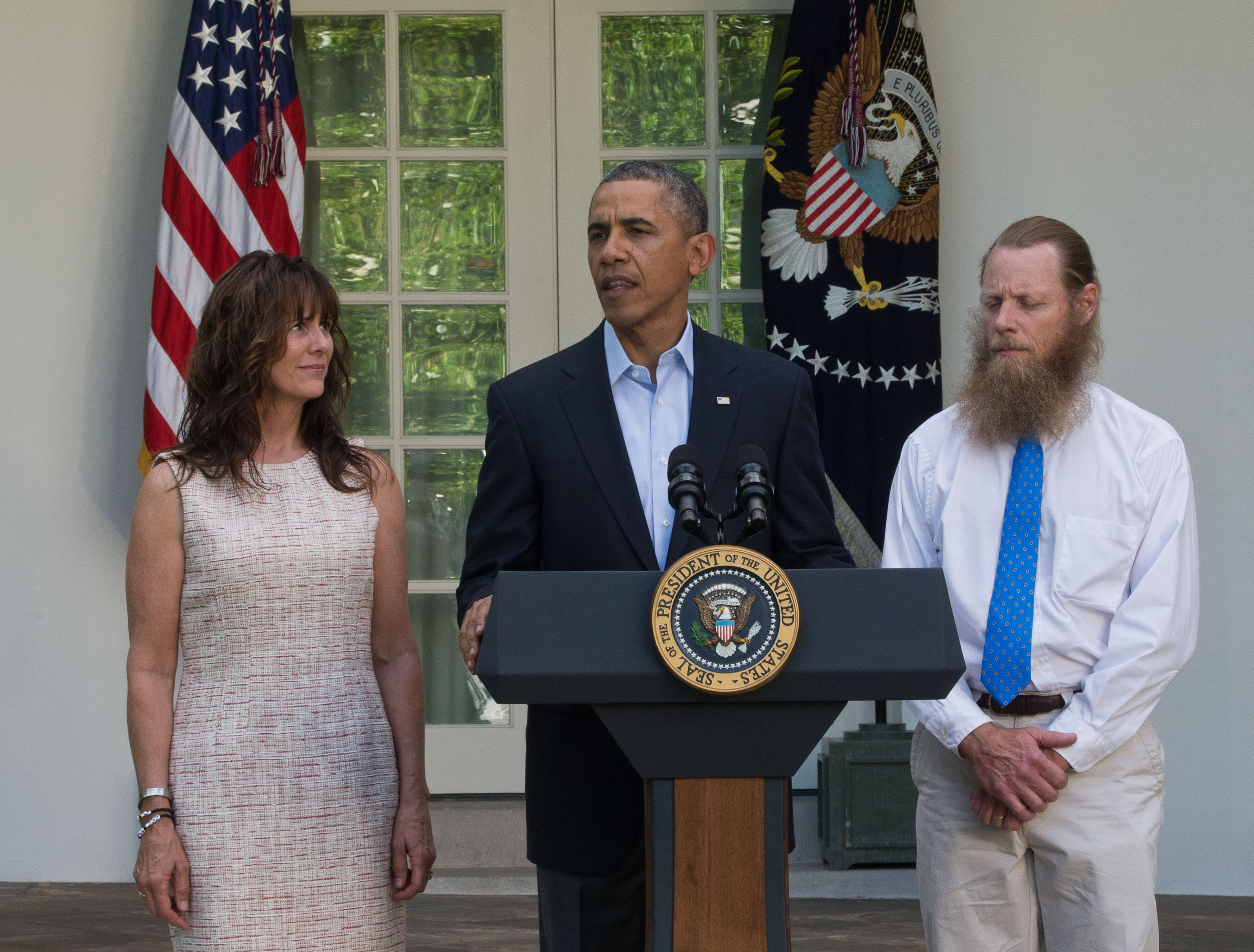 President Barack Obama makes a statement about the release of Sgt. Bowe Bergdahl as his parents, Jani Bergdahl (L) and Bob Bergdahl (R) listen May 31, 2014 in the Rose Garden at the White House in Washington, DC. Sgt. Bowe Bergdahl was held captive by militants for almost five years during the war in Afghanistan. (Getty)
