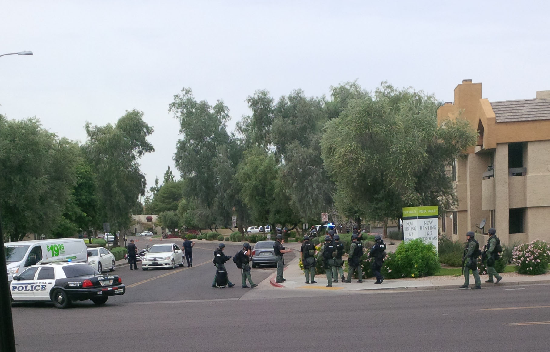 Police search the Vista Valley apartments in Mesa, Arizona for a gunman who killed one man and wounded several other people. (Pac.BRIM/Instagram)