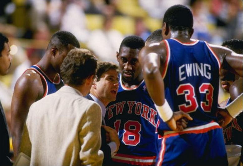 Oct 1987: Head coach Rick Pitino of the New York Knicks talks to Patrick Ewing #33 and other teammates during a Knicks versus Los Angeles Lakers game at the Great Western Forum in Inglewood, California. (Getty/Rick Stewart /Allsport)