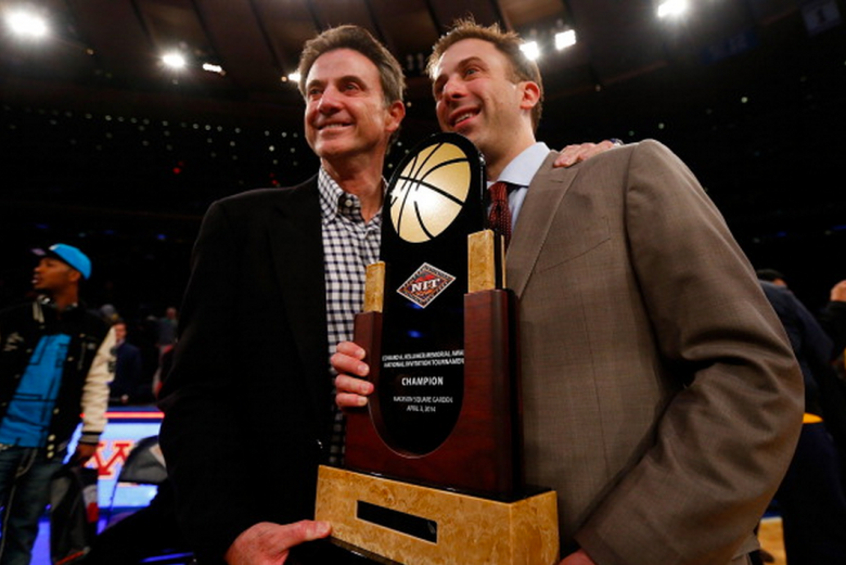 Head Coach Richard Pitino of the Minnesota Golden Gophers celebrates with his father Rick Pitino after defeating the Southern Methodist Mustangs to win the 2014 NIT Championship at Madison Square Garden on April 3, 2014 in New York City. (Getty)