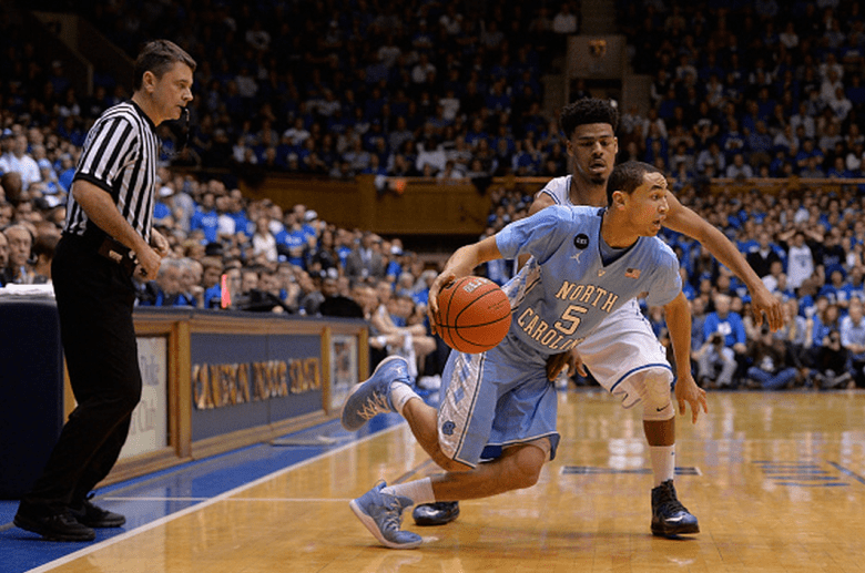 Quinn Cook #2 of the Duke Blue Devils defends Marcus Paige #5 of the North Carolina Tar Heels during their game at Cameron Indoor Stadium on February 18, 2015 in Durham, North Carolina. Duke won 92-90 in overtime. (Getty)