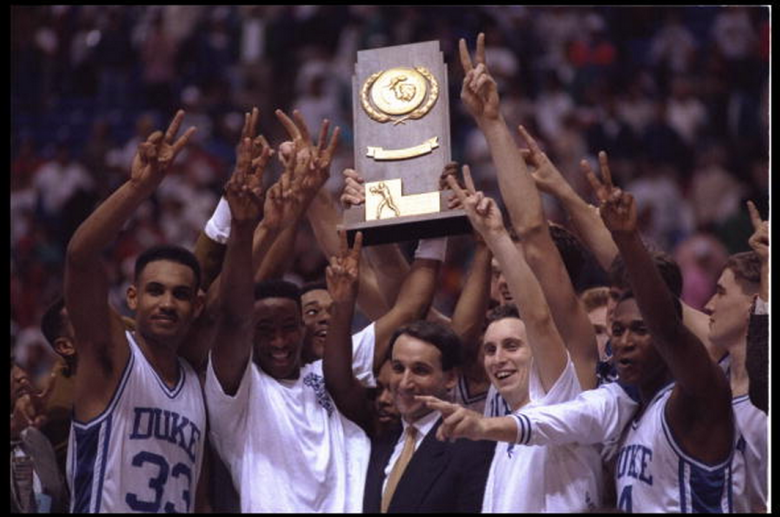 Head coach Mike Krzyzewski and his Duke Blue Devils revel in their glory after winning their second consecetive NCAA basketball championship by beating the Michigan Wolverines on April 6, 1992 at the Hubert H. Humphrey Metrodome in Minneapolis, Minnesota. The Blue Devils defeated the Wolverines 71-51. Second two the left is Grant Hill #33. (Getty)