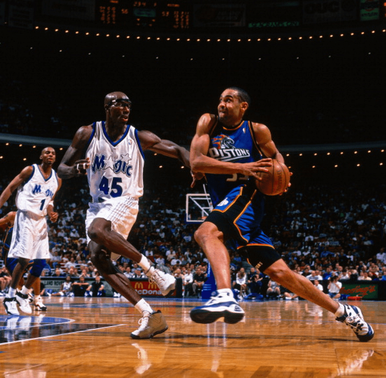 Grant Hill #33 of the Detroit Pistons dribbles against Bo Outlaw #45 of the Orlando Magic during a game circa 1999 at the Orlando Arena in Orlando, Florida. NOTE TO USER: User expressly acknowledges and agrees that, by downloading and or using this photograph, User is consenting to the terms and conditions of the Getty Images License Agreement. Mandatory Copyright Notice: Copyright 1999 NBAE (Getty)