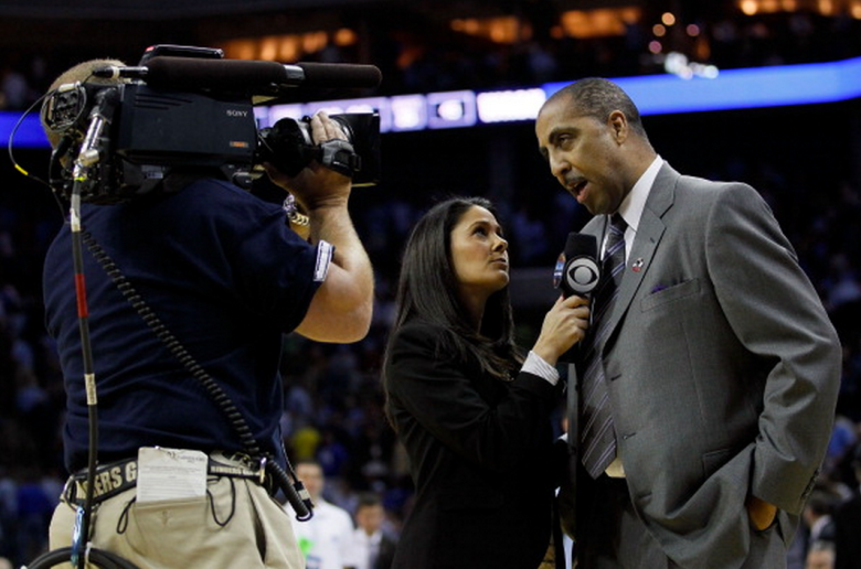 Head coach Lorenzo Romar of the Washington Huskies is interviewed by CBS reporter Tracy Wolfson while taking on the North Carolina Tar Heels during the third round of the 2011 NCAA men's basketball tournament at Time Warner Cable Arena on March 20, 2011 in Charlotte, North Carolina. (Getty)