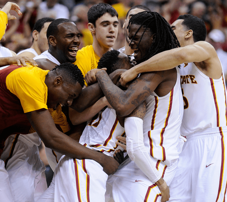 Monte Morris #11 of the Iowa State Cyclones is congratulated by teammates after hitting the game-winning basket against the Texas Longhorns during the quarterfinal round of the Big 12 basketball tournament at Sprint Center on March 12, 2015 in Kansas City, Missouri. Iowa State won 69-67. (Getty)
