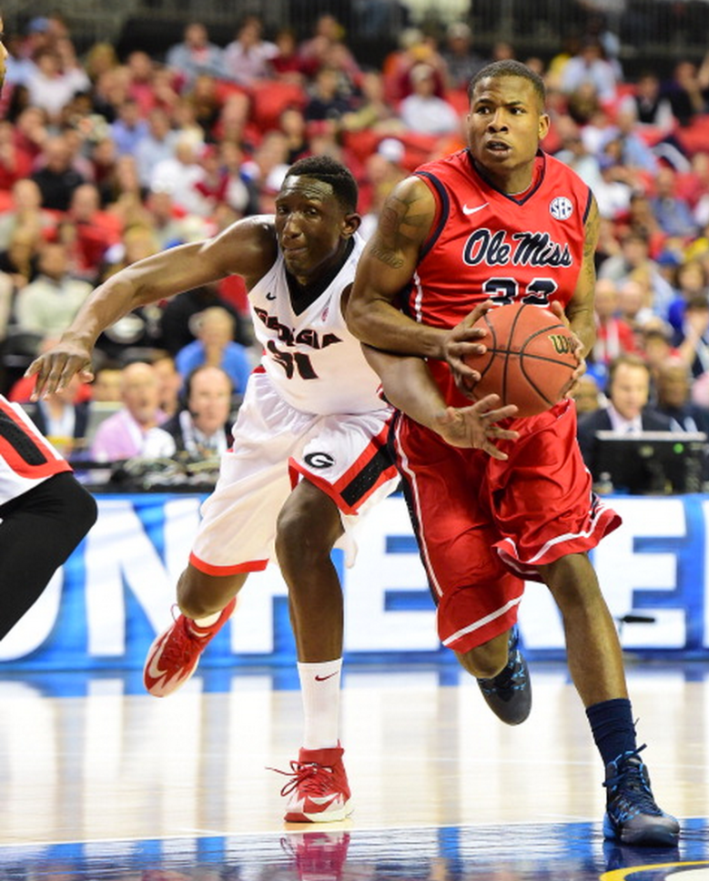 Jarvis Summers #32 of the Ole Miss Rebels drives against Brandon Morris #31 of the Georgia Bulldogs during the quarterfinals of the SEC Men's Basketball Tournament at the Georgia Dome on March 14, 2014 in Atlanta, Georgia. (Getty)
