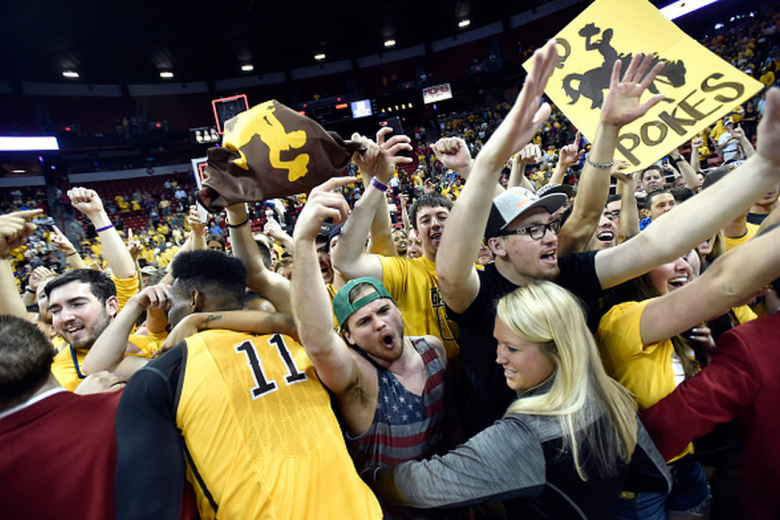 Wyoming Cowboys' fans celebrate defeating the San Diego State Aztecs during the championship game of the Mountain West Conference basketball tournament at the Thomas & Mack Center on March 14, 2015 in Las Vegas, Nevada. Wyoming won 45-43. (Getty)
