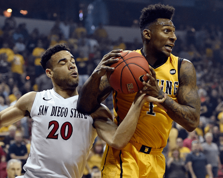 Charles Hankerson Jr. #1 of the Wyoming Cowboys grabs a rebound from J.J. O'Brien #20 of the San Diego State Aztecs during the championship game of the Mountain West Conference basketball tournament at the Thomas & Mack Center on March 14, 2015 in Las Vegas, Nevada. (Getty)