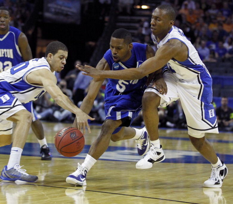 Hampton's Brandon Tunnell (5) drives between Duke's Seth Curry (30), left, and Nolan Smith (2) during the first half in the second round of the 2011 NCAA Men's Basketball Championship at Time Warner Cable Arena in Charlotte, North Carolina, Friday, March 18, 2011. Duke beat Hampton, 87-45. (Getty)