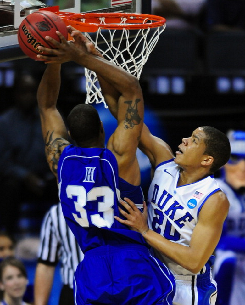 Duke Blue Devils Andre Dawkins (20) goes for a block of Hampton Pirates Koron Reed's (33) shot on a drive to the basket during first half action Friday, March 18, 2011 at Time Warner Cable Arena in Charlotte, North Carolina for the 2011 NCAA Division I Men's Basketball Championship. (Getty)