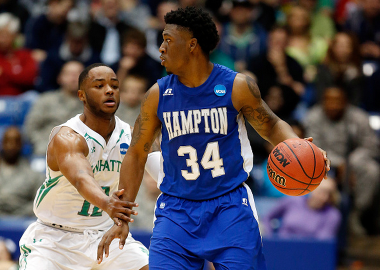 Reginald Johnson #34 of the Hampton Pirates controls the ball as RaShawn Stores #12 of the Manhattan Jaspers defends during the first round of the 2015 NCAA Men's Basketball Tournament at UD Arena on March 17, 2015 in Dayton, Ohio. (Getty)