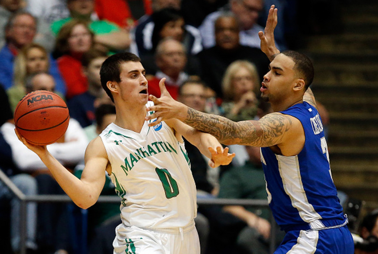 Shane Richards #0 of the Manhattan Jaspers looks to pass the ball as Quinton Chievous #3 of the Hampton Pirates defends during the first round of the 2015 NCAA Men's Basketball Tournament at UD Arena on March 17, 2015 in Dayton, Ohio. (Getty)